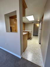 Hallway featuring baseboards