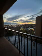 Balcony at dusk with a city view