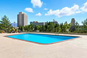 Community pool featuring a patio area