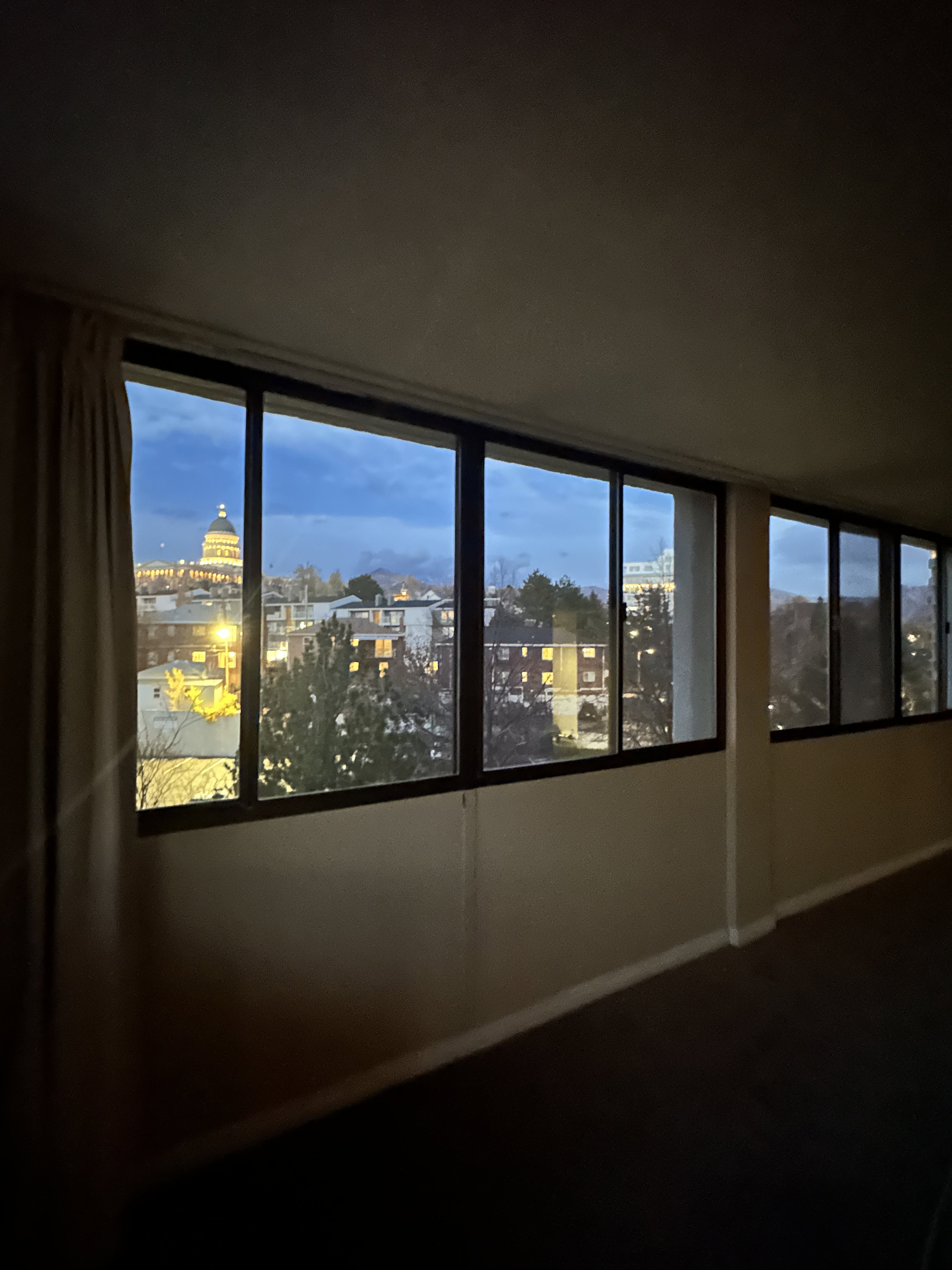 Unfurnished room with a view of city