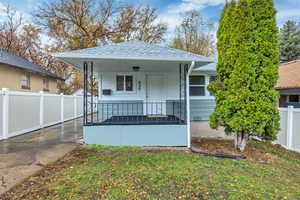 Shotgun-style home with covered porch