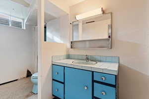 Bathroom featuring vanity and tile patterned floors