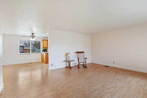 Unfurnished room featuring light wood-style floors, ceiling fan, and recessed lighting