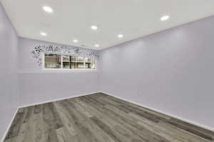 Unfurnished room featuring recessed lighting and wood finished floors