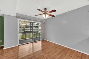 Spare room featuring light wood-style floors and ceiling fan