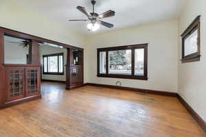 Spare room with light wood-style floors and a ceiling fan