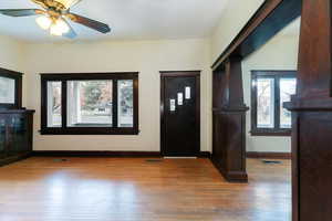 Entrance foyer with healthy amount of natural light, light wood-style floors, and a ceiling fan