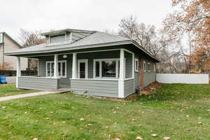 View of front of house with a porch and roof with shingles