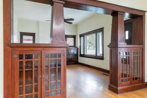 Living area featuring light wood finished floors and ceiling fan