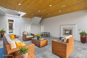 View of patio / terrace with an outdoor living space with a fireplace