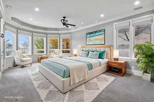 Carpeted bedroom with ornamental molding, recessed lighting, and ceiling fan