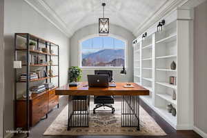 Office featuring dark wood-type flooring, lofted ceiling, and ornamental molding