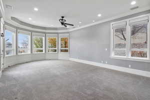 Spare room featuring crown molding, recessed lighting, carpet, and ceiling fan