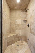 Bathroom featuring a tile shower