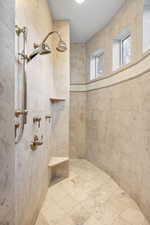 Bathroom featuring tiled shower