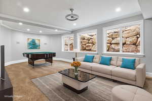 Living room featuring crown molding and recessed lighting