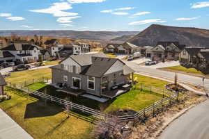 Aerial perspective of suburban area featuring a mountain backdrop