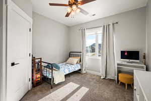 Bedroom featuring carpet floors and ceiling fan