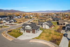 Aerial view of residential area featuring a mountainous background