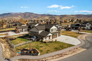 Aerial view of residential area featuring mountains