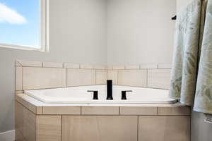 Full bath with a garden tub