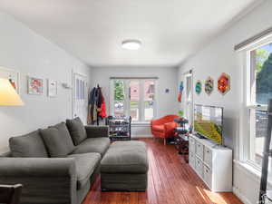 Living area featuring wood-type flooring and baseboards
