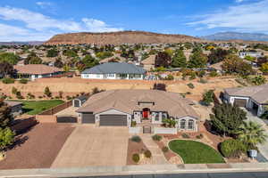 Aerial view of residential area featuring a mountainous background