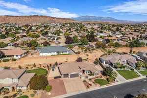 Aerial view of residential area featuring mountains