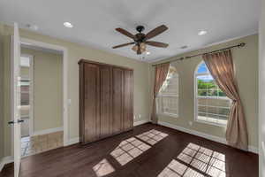 Unfurnished bedroom with recessed lighting, a closet, a ceiling fan, and dark wood finished floors