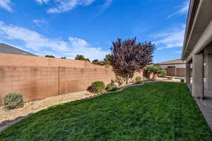 View of fenced backyard