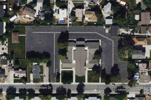 Aerial overview of property's location with nearby suburban area