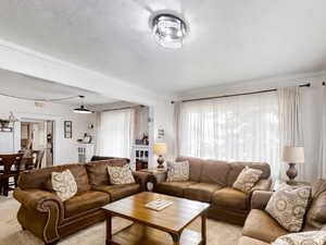 Living room featuring light colored carpet