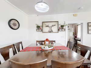 Dining area featuring ornamental molding