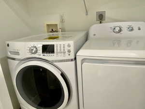 Laundry room with washing machine and dryer
