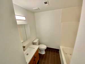 Bathroom featuring vanity and a textured ceiling