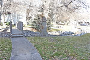 View of property's community featuring a yard