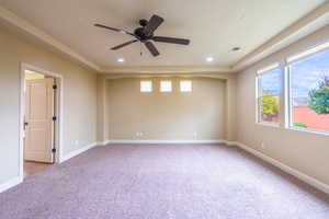 Unfurnished room featuring light colored carpet, plenty of natural light, recessed lighting, and ceiling fan