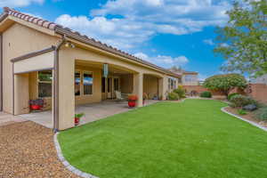 Fenced backyard with a patio