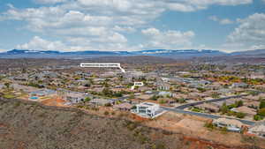 Aerial view of residential area featuring a mountainous background