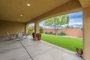 Fenced backyard featuring a patio area and outdoor dining space