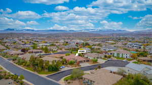 Aerial perspective of suburban area with a mountainous background