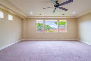 Unfurnished room with light carpet, a ceiling fan, and recessed lighting