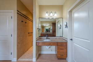 Full bath with vanity and a walk in shower