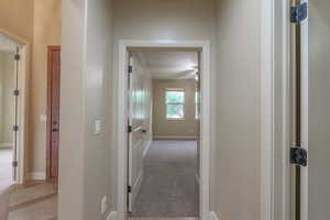 Hallway featuring baseboards