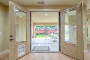 Entryway with wood finished floors