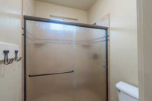 Bathroom featuring a shower stall