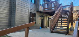 Property entrance with a wooden deck