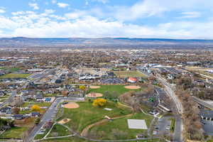 Aerial view of property and surrounding area with mountains