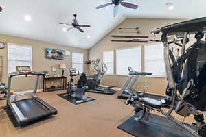 Gym with vaulted ceiling, recessed lighting, TV, and a ceiling fan