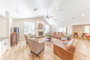 Sitting/conversation area with fireplace and vaulted ceilings